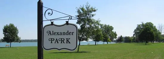 Alexander Park sign and trees along the waterfront