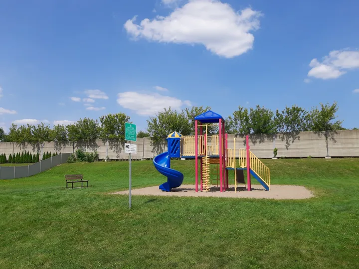 Play unit and bench against blue sky