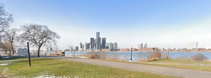 Pathway along the Windsor riverfront with Detroit skyline in the background